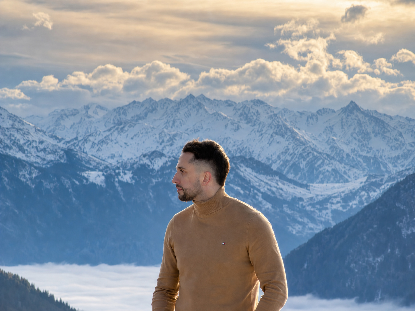 Aday González overlooking the snowy Alps in Switzerland