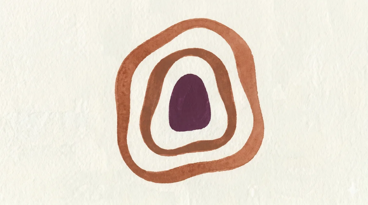 Hand-painted Noondra mark in terracotta and plum on textured paper.